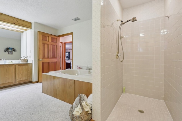 bathroom featuring vanity and tiled shower