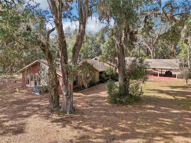 exterior space featuring a carport