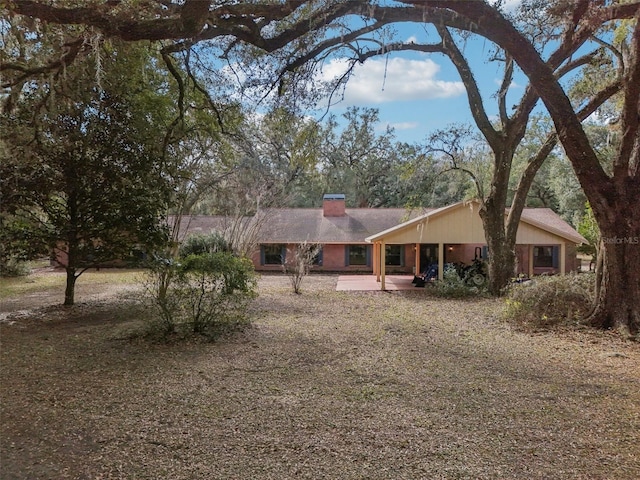 ranch-style house featuring a patio