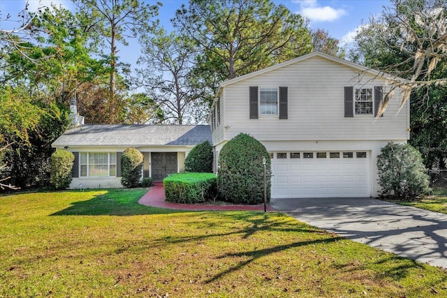 view of front of house with a garage and a front lawn