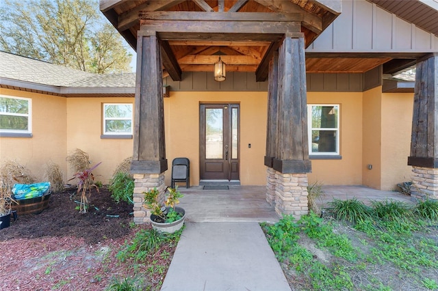 doorway to property featuring covered porch