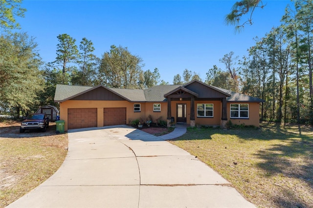 view of front of property featuring a front lawn and a garage