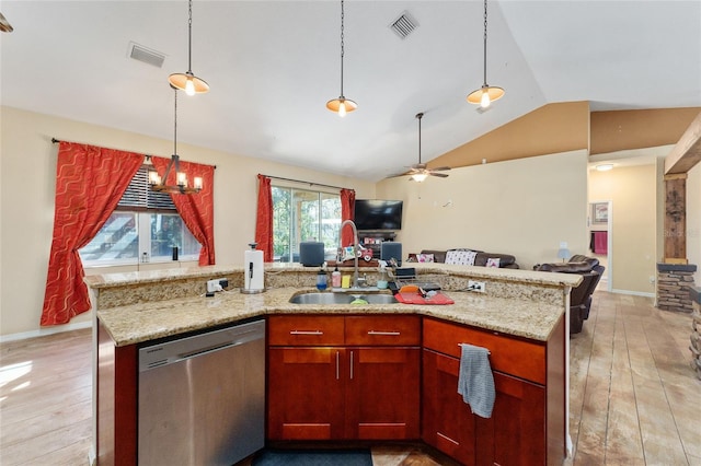 kitchen with light stone countertops, dishwasher, an island with sink, sink, and hanging light fixtures