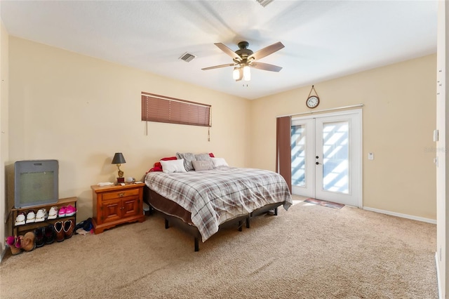 carpeted bedroom featuring ceiling fan, access to exterior, and french doors