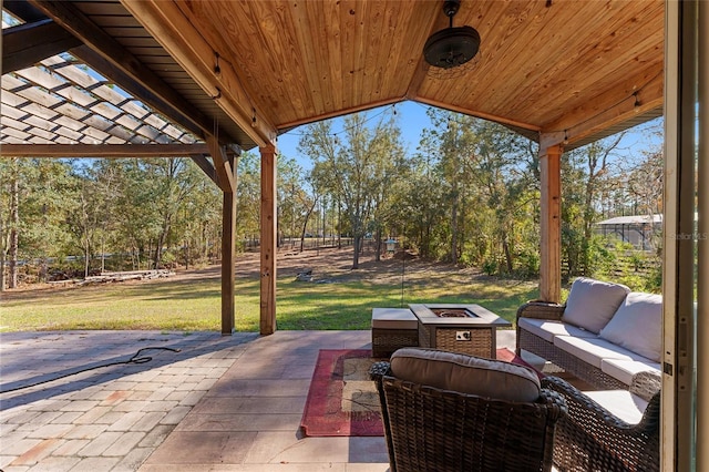 view of patio / terrace featuring an outdoor living space with a fire pit and a pergola