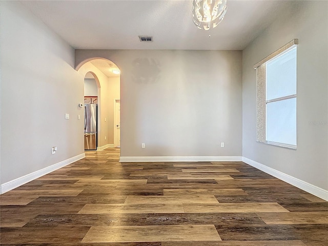 empty room featuring dark hardwood / wood-style flooring