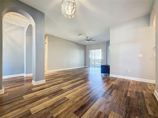 spare room with ceiling fan and dark hardwood / wood-style floors