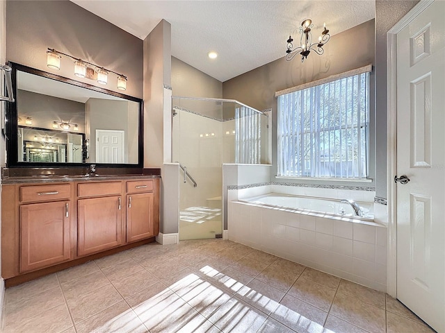 bathroom with a textured ceiling, lofted ceiling, independent shower and bath, tile patterned floors, and vanity