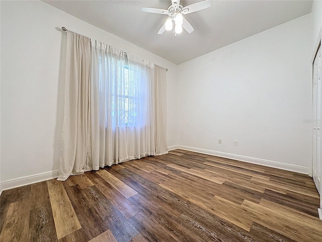 spare room with hardwood / wood-style flooring and ceiling fan