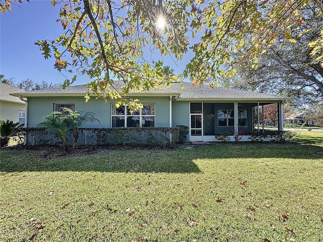 rear view of house with a lawn