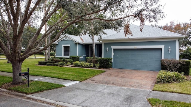 ranch-style home with a front yard and a garage