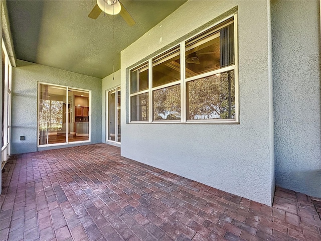 view of patio / terrace featuring ceiling fan