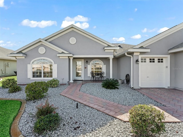 ranch-style house featuring a garage