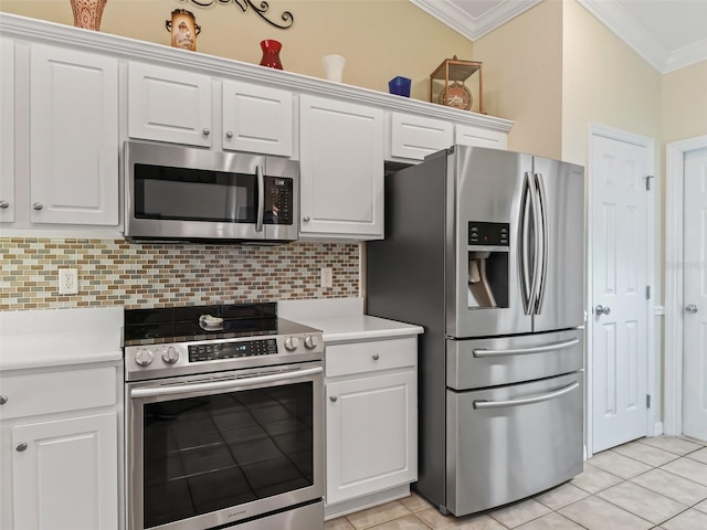 kitchen featuring white cabinets, appliances with stainless steel finishes, backsplash, light tile patterned floors, and crown molding