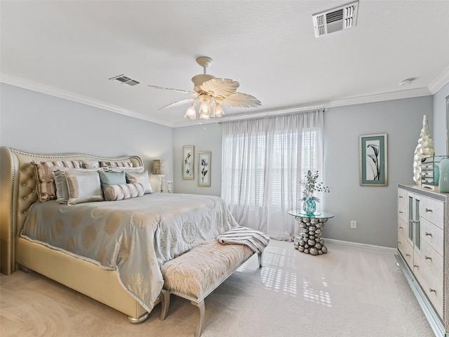 carpeted bedroom with ceiling fan and crown molding