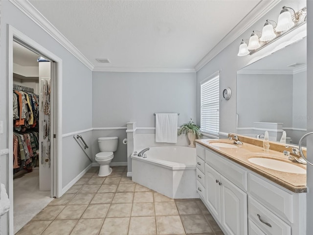 bathroom featuring a tub to relax in, tile patterned flooring, toilet, vanity, and ornamental molding