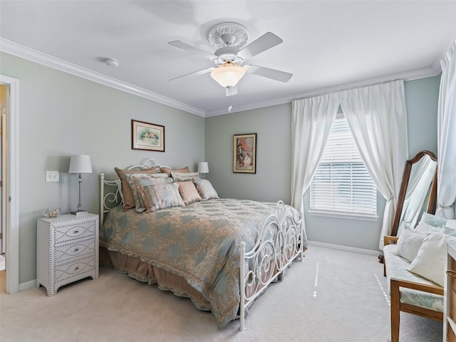 carpeted bedroom featuring ceiling fan and ornamental molding