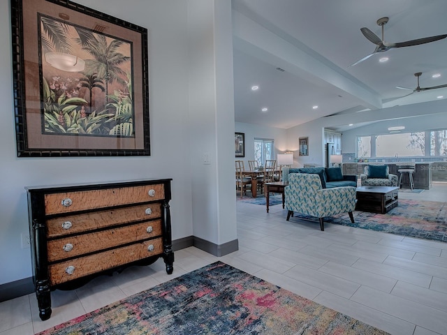 hall featuring lofted ceiling with beams and light tile patterned floors