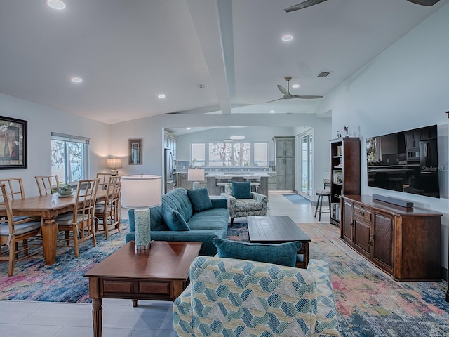 living room with light tile patterned flooring, lofted ceiling with beams, and ceiling fan