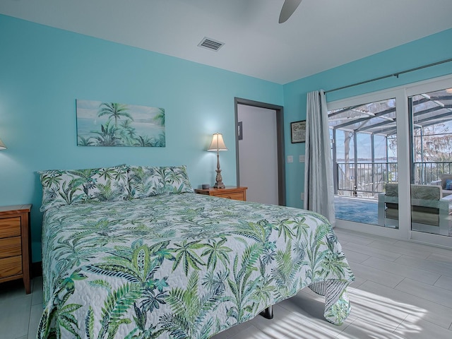 tiled bedroom featuring ceiling fan and access to outside