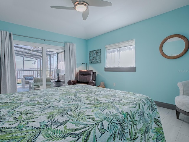 tiled bedroom featuring ceiling fan, access to exterior, and multiple windows