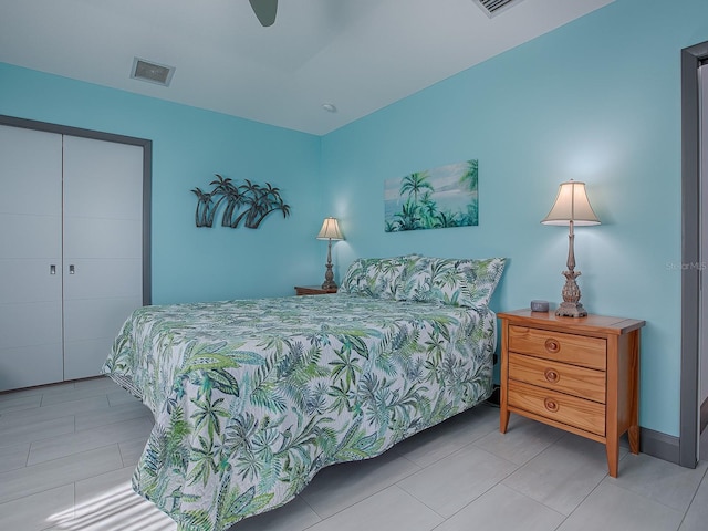 bedroom with ceiling fan and a closet