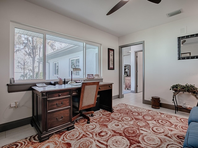 home office with ceiling fan and light tile patterned flooring