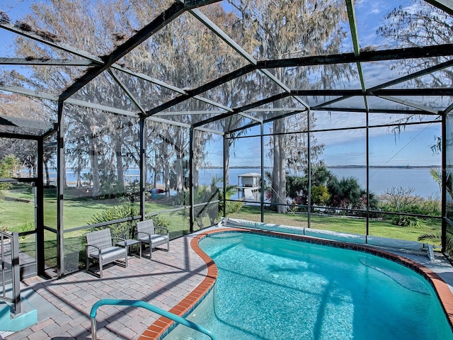 view of pool featuring a patio area, a lanai, and a yard