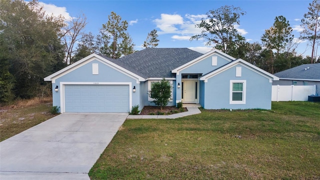 view of front facade featuring a garage and a front yard