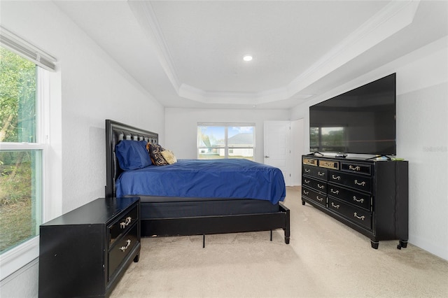 carpeted bedroom with ornamental molding, a raised ceiling, and multiple windows