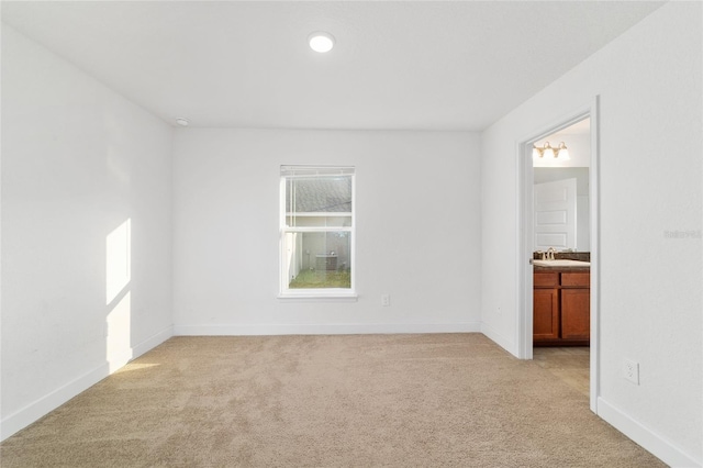 empty room featuring light carpet