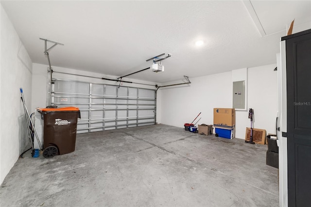 garage featuring a garage door opener and electric panel