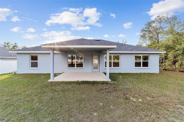 rear view of property with a patio area and a lawn