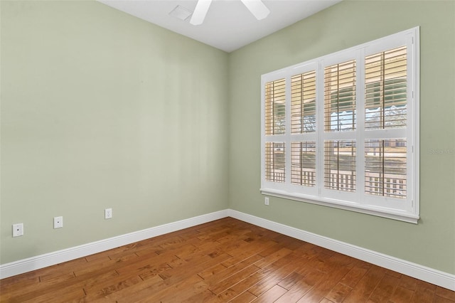 unfurnished room with hardwood / wood-style flooring and ceiling fan