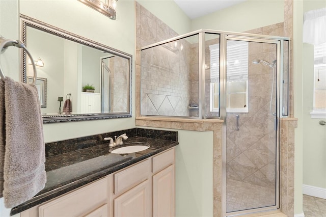 bathroom with vanity and walk in shower