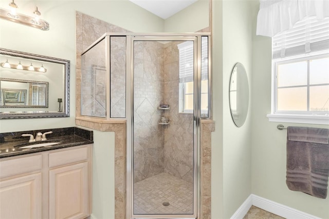 bathroom featuring vanity and an enclosed shower