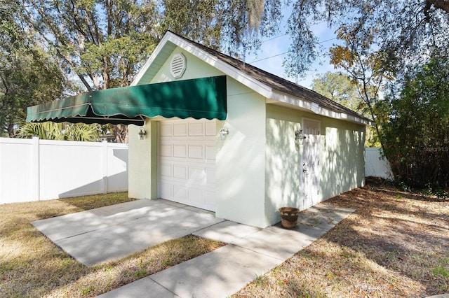 view of outbuilding with a garage