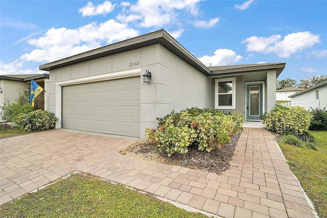 single story home featuring a garage