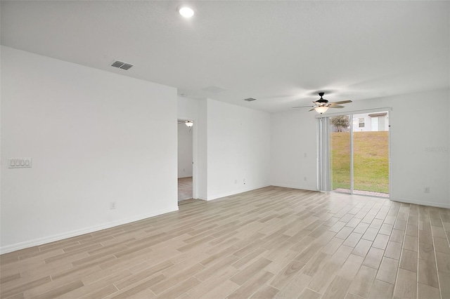 unfurnished room with ceiling fan and light wood-type flooring