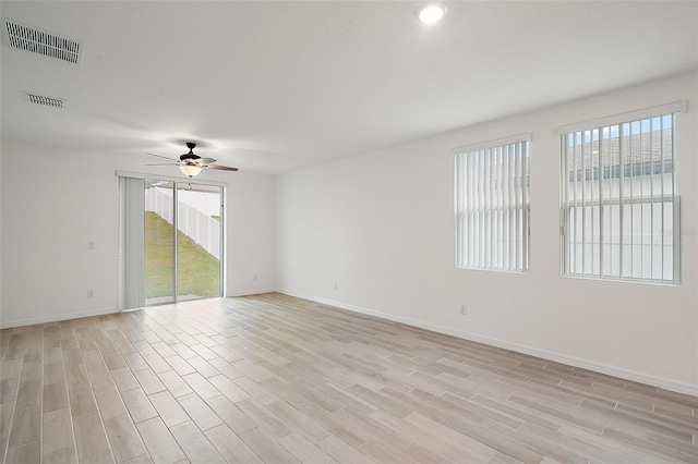 unfurnished room with ceiling fan and light hardwood / wood-style flooring