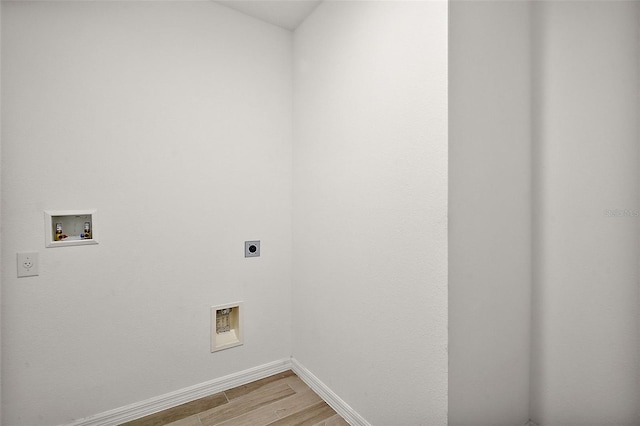 washroom featuring washer hookup, light wood-type flooring, and electric dryer hookup