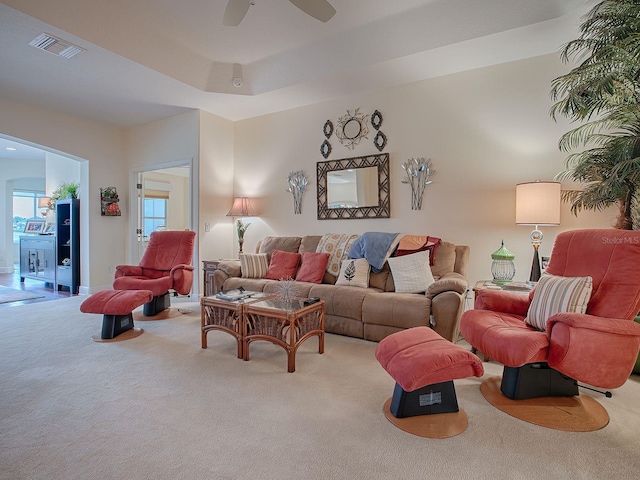 carpeted living room featuring ceiling fan