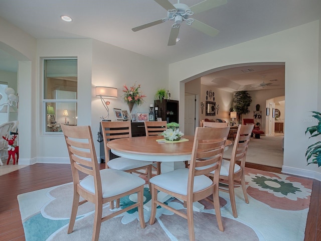 dining space featuring ceiling fan and hardwood / wood-style flooring