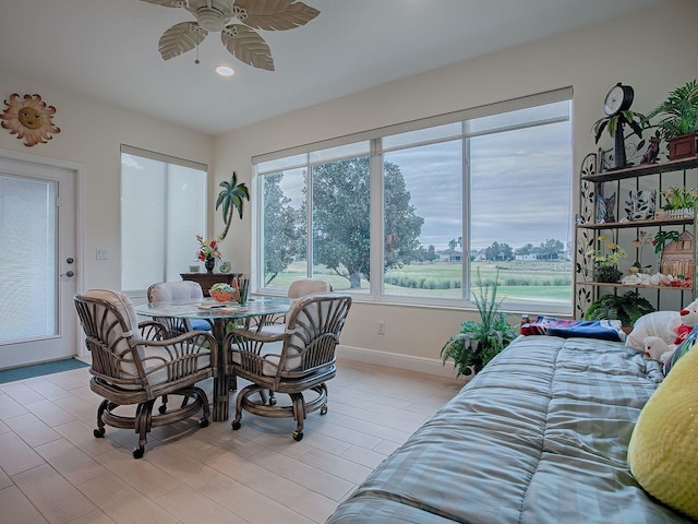 dining area with ceiling fan and light hardwood / wood-style floors