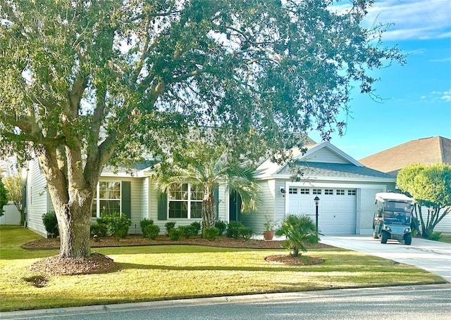 view of front of home featuring a front lawn and a garage