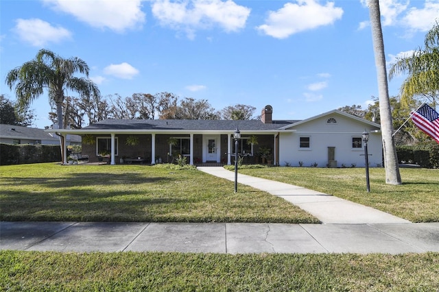 ranch-style house featuring a front lawn