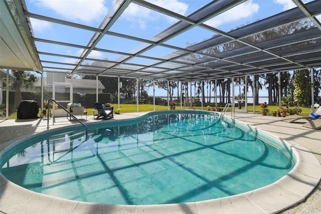 view of pool featuring a lanai and a patio area