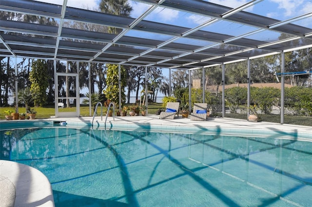 view of pool with a lanai and a patio