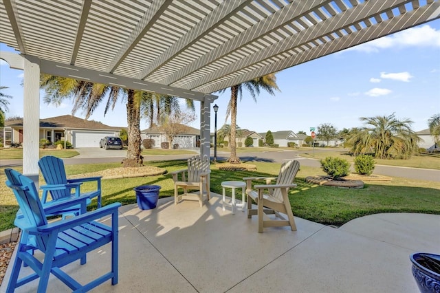 view of patio featuring a garage and a pergola