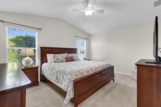 bedroom featuring ceiling fan, light colored carpet, and lofted ceiling